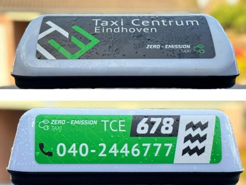 Aan deze bordjes herken je een elektrische taxi, klik voor een vergroting